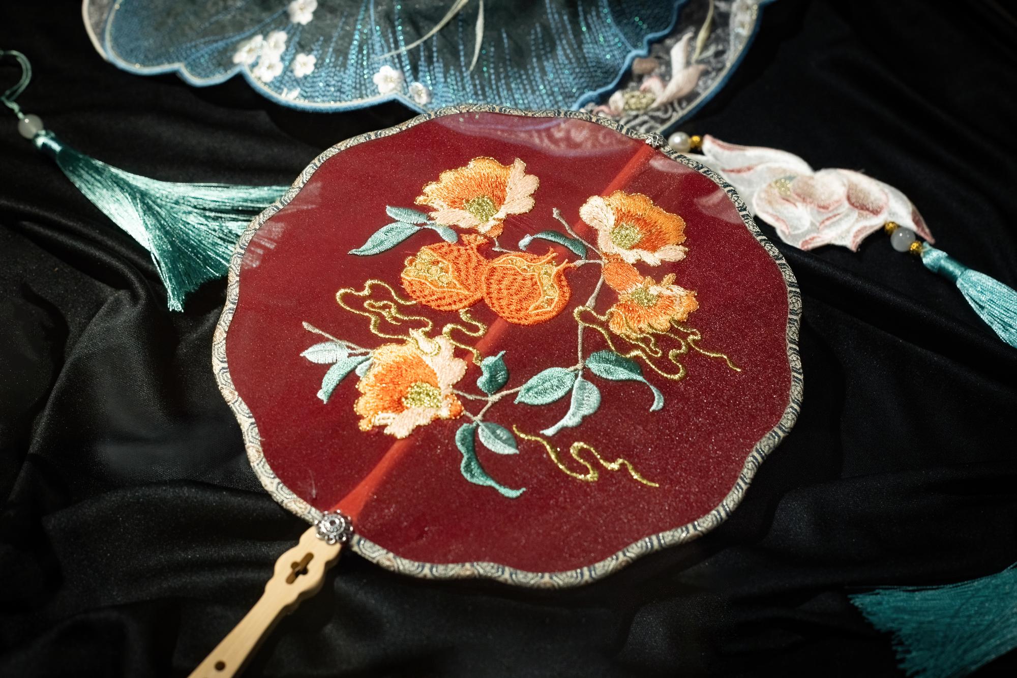 Close-up of embroidered floral patch on fabric
